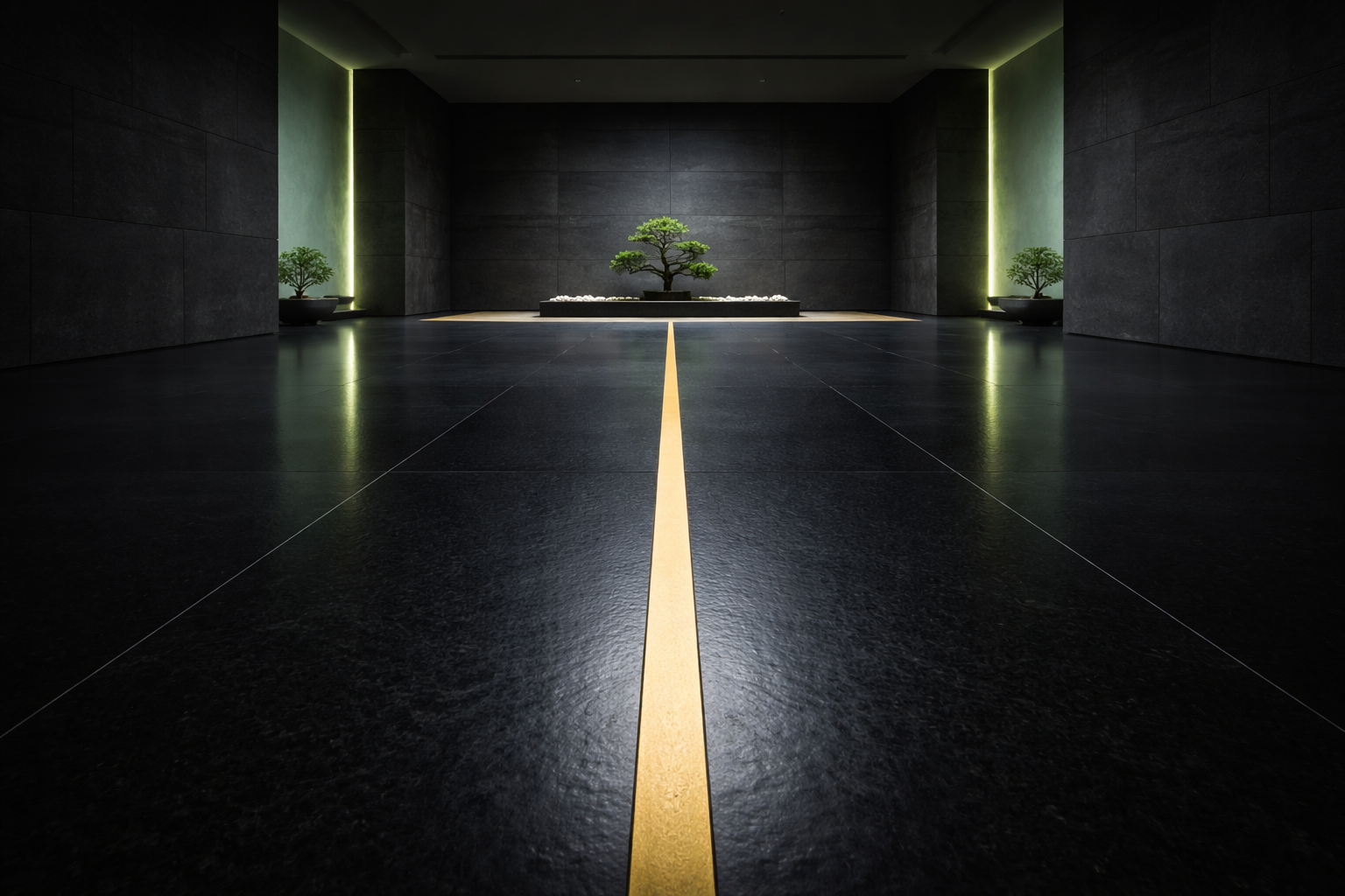 A wide-angle, cinematic view of a vast, minimalist interior with a polished black obsidian stone floor. A razor-thin gold inlay runs straight down the center of the floor, forming a clear boundary line that draws the eye into the distance. Deep charcoal stone walls surround the space, with soft sage-green ambient light glowing along the edges. The room is empty, quiet, and symmetrical, conveying a sense of calm authority, balance, and inner stillness.